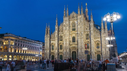 Fototapeta na wymiar Milan Cathedral day to night timelapse Duomo di Milano is the gothic cathedral church of Milan, Italy.