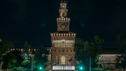 Obraz premium Main entrance to the Sforza Castle and tower - Castello Sforzesco night timelapse, Milan, Italy