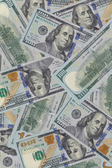 Hundred dollar bills or banknotes background. American money full background close-up and flat lay. High detail usd background and texture.