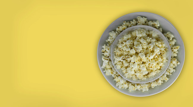 Popcorn with isolated natural background. Delicious and unhealty foods. Diet nutrition. Cinema and movie classic.