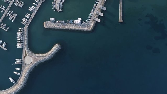 Marina area in summer morning, yachts and boats, beautiful seafront. Limassol, Cyprus. Aerial footage, top view.