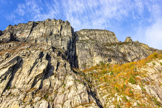 Preikestolen (also called Preachers Pulpit, Preachers Chair and Pulpit Rock) is a famous steep cliff with a flat plateau. View upwards from the water surface of the Lysefjord, a fjord in Norway