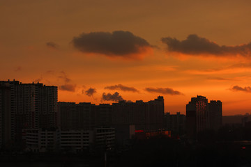 Fototapeta na wymiar Fire-red sunset in a big city, Kiev, Ukraine