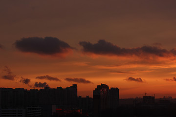 Fototapeta na wymiar Fire-red sunset in a big city, Kiev, Ukraine
