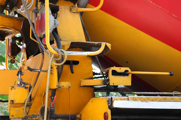Close up Cement truck, pouring cement into a foundation