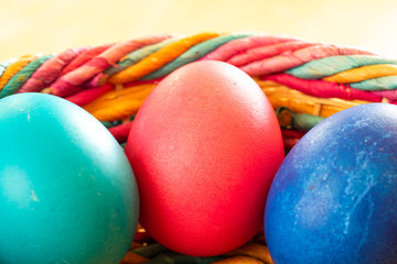 Colorful Easter eggs in a wicker basket