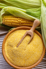 Polenta corn porridge on white wooden rustic background
