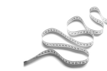 The figure is spiral of a centimeter tape. Isolate measuring tape on a white background.