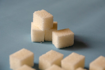 White sweet sugar on a blue background