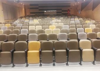 Empty chairs of auditorium or movie theater.
