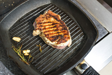 Cooking grilled pork loin. Tasty and hearty food. Cooking for restaurant guests