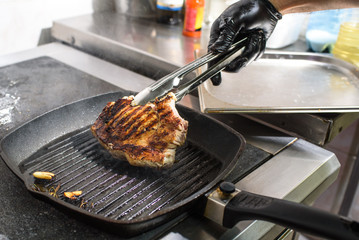 Cooking grilled pork loin. Tasty and hearty food. Cooking for restaurant guests