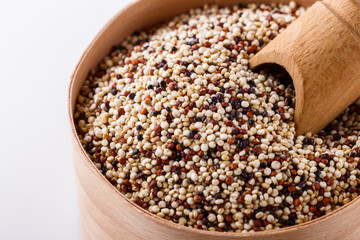 mix of quinoa grains on white acrylic background