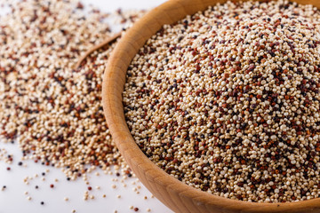 mix of quinoa grains on white acrylic background