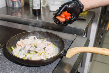 The process of roasting squid. Delicious seafood.