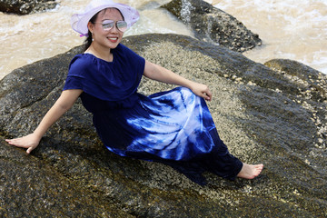 Beautiful Asia young woman smile portrait on the beach in summer at Phuket, Thailand.