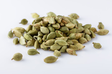 fragrant green cardamom on a white acrylic background