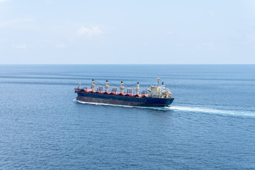 Obraz premium A old bulk carrier or bulker sails in the sea to trade around the world