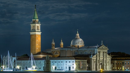 Fototapeta na wymiar A view of the Cathedral of San Giorgio Maggiore from San Marco square at night timelapse, Venice, Italy