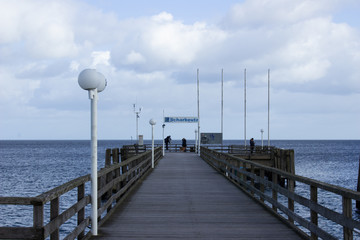 Fototapeta na wymiar pier on the sea in Scharbeutz, Germany