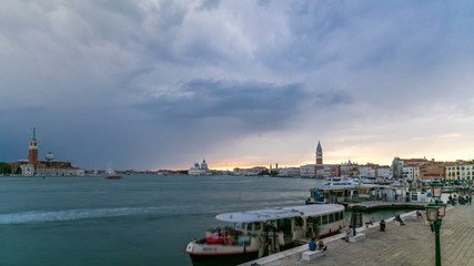 Naklejka premium Basilica Santa Maria della Salute, Cathedral of San Giorgio Maggiore at sunset timelapse, Venezia, Venice, Italy