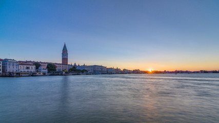 Fototapeta na wymiar Beautiful sunrise in Grand canal over San Marco square timelapse. View from Church of Santa Maria della Salute, Venice, Italy, European Union.