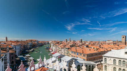 Fototapeta na wymiar Top view on central busy canal in Venice timelapse, on both sides masterpieces of Venetian architecture