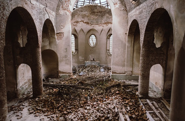 Ruins of the old church near Lviv, Ukraine. Ancient columns, ruined altar, and shady walls. Concept...