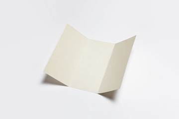 A4. Blank Trifold Paper Brochure Mock-up on soft gray background with shadow.High resolution photo.Top view