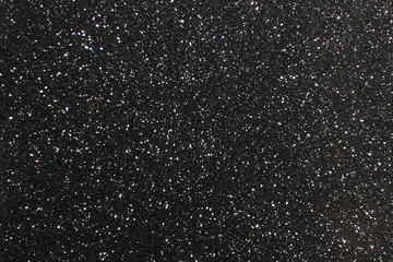 Black surface with glare. Black and white texture background.