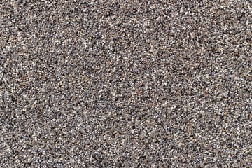 Decorative plaster - the wall is covered with small stones.