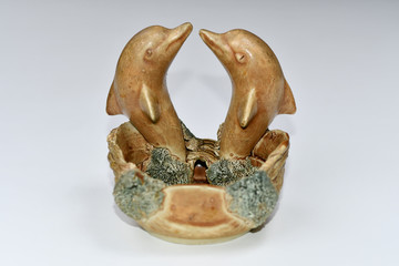 gold dolphins decoration white background