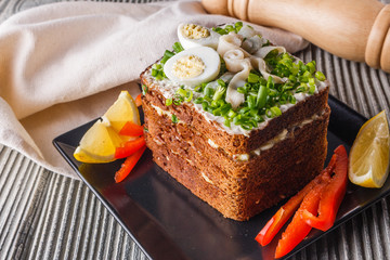 a huge herring sandwich with mayonnaise and quail eggs