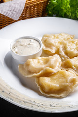 traditional Ukrainian dish of dumplings with sour cream