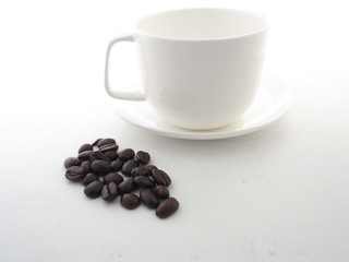 Coffee cup and coffee beans on white background.Have copy space.for banner,wallpaper.