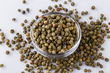 green peppers in glass bowl on white background