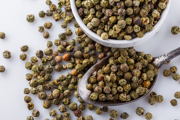 green peppers in bowl on white background