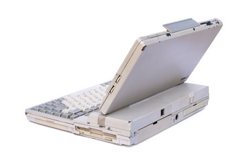 Old laptop computer or portable personal computer isolated on white background with clipping path....