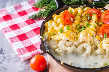 delicious pasta and cheese casserole in a cast iron skillet