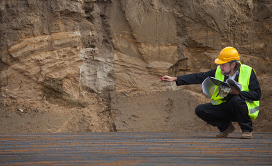 inspector checks the construction parameters of foundation