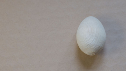 Wooden Easter egg on a natural background.