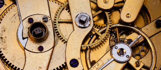 Authentic 100 hundred years old pocket watch mechanism cogs close up Macro