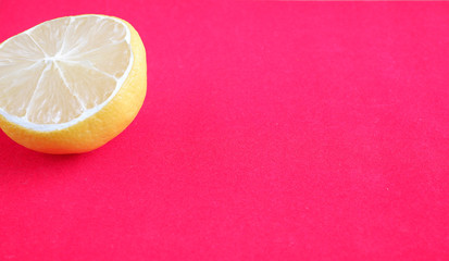 Lemons on a red background. Citrus fruit