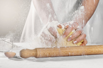 Master baker kneads culinary dough for the manufacture of confectionery.