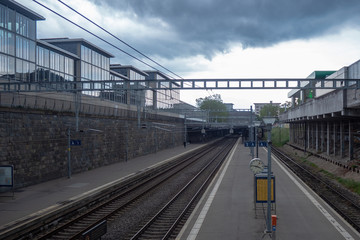 Naklejka premium Empty platform at train station in midtown of Zurich on cloudy sky and background with copy space , Switzerland