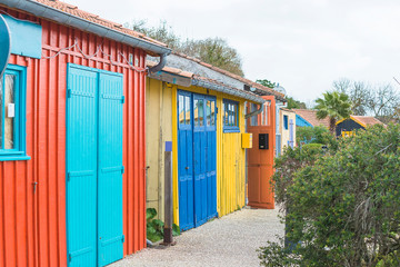 Fototapeta premium Multicolored fisher's huts on coastline of Atlantic ocean