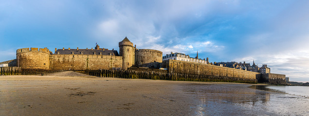 Saint Malo cityscape or skyline at dusk. Medieval ramparts surrounding the historic town from Plage...