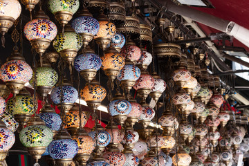 Lamps with patterns of traditional Turkish architecture. Photographed in front of the historical Egypt bazaar.