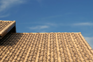 Brown Roof Tiling with Blue Sky Background