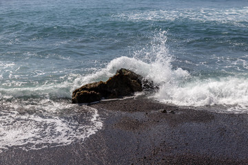 waves crashing on rocks